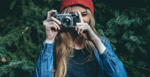 Hipster holding camera