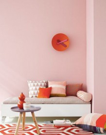 Pink, orange and red living space with pink wall