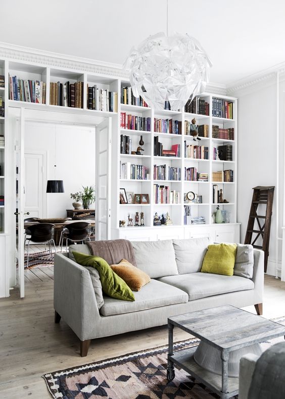 white bookshelf wall in living room