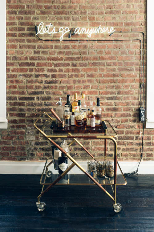 neon light above bar cart