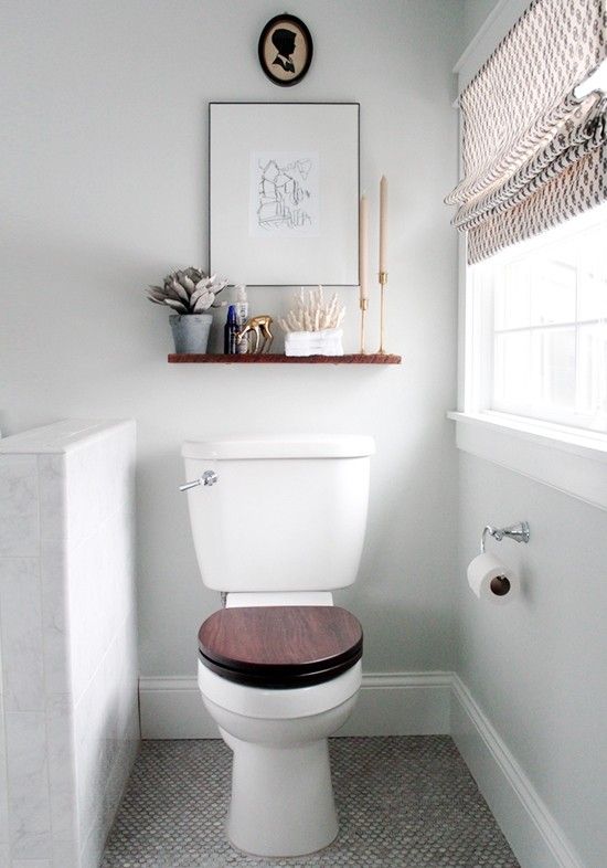 Small bathroom ideas - shelf and wallart about toilet