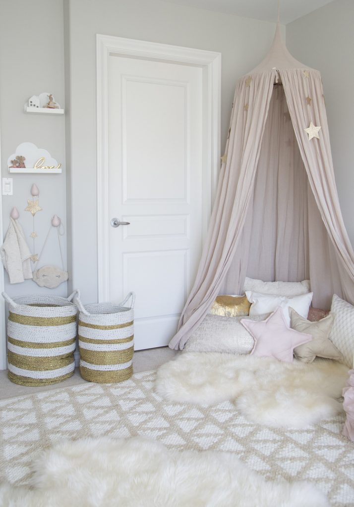 Small bedroom decorating ideas - pink canopy and fuzzy rug