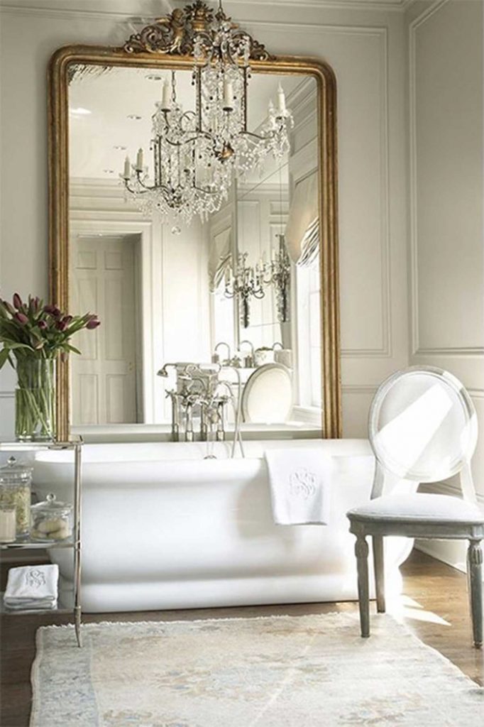 French accent style gold mirror in bathroom