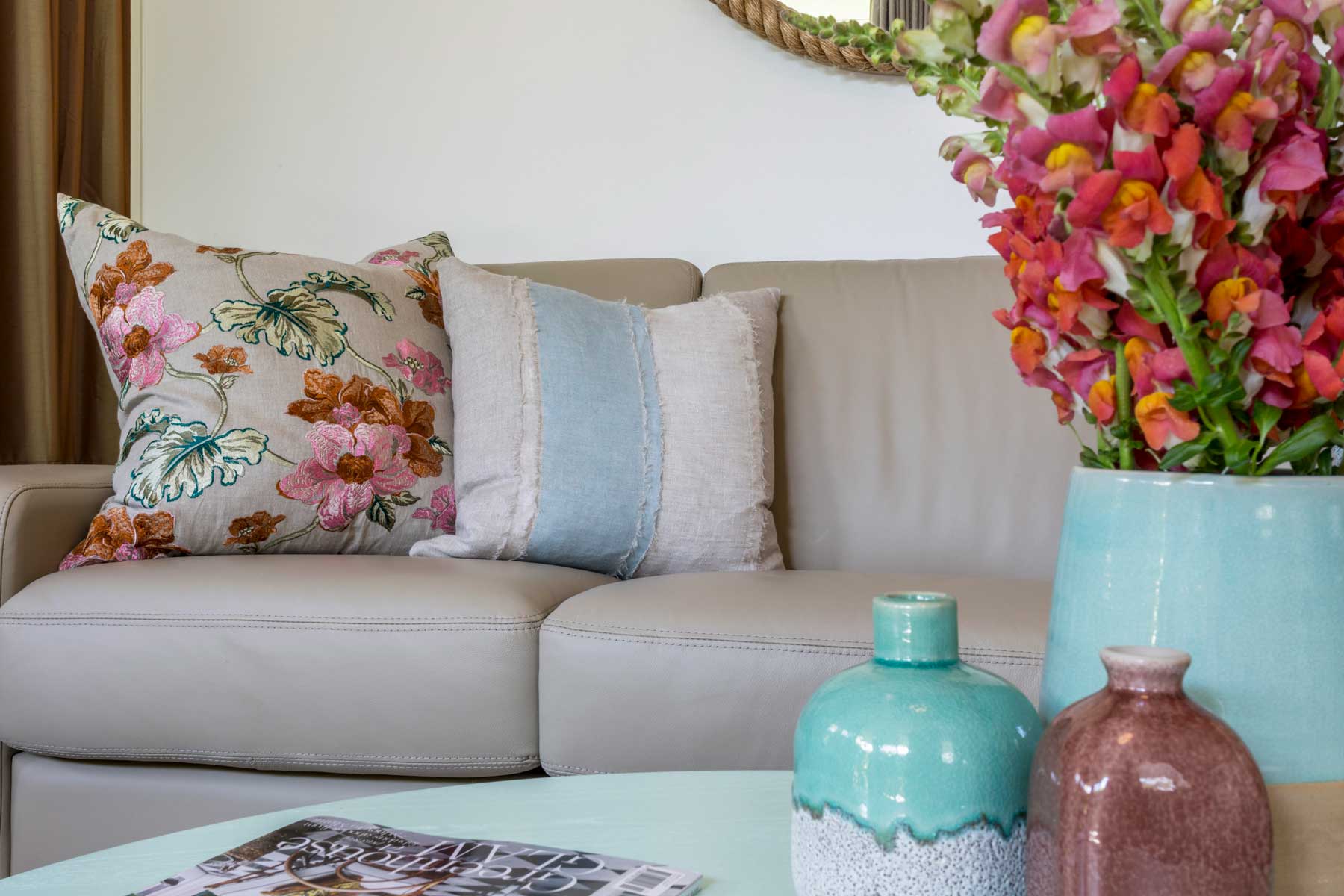 Robyn's vibrant beach apartment - after - cushion vases