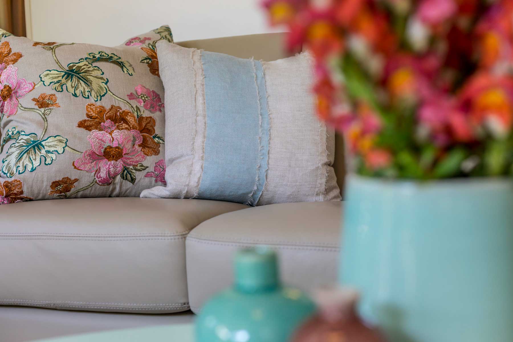 Robyn's vibrant beach apartment - after - floral cushions